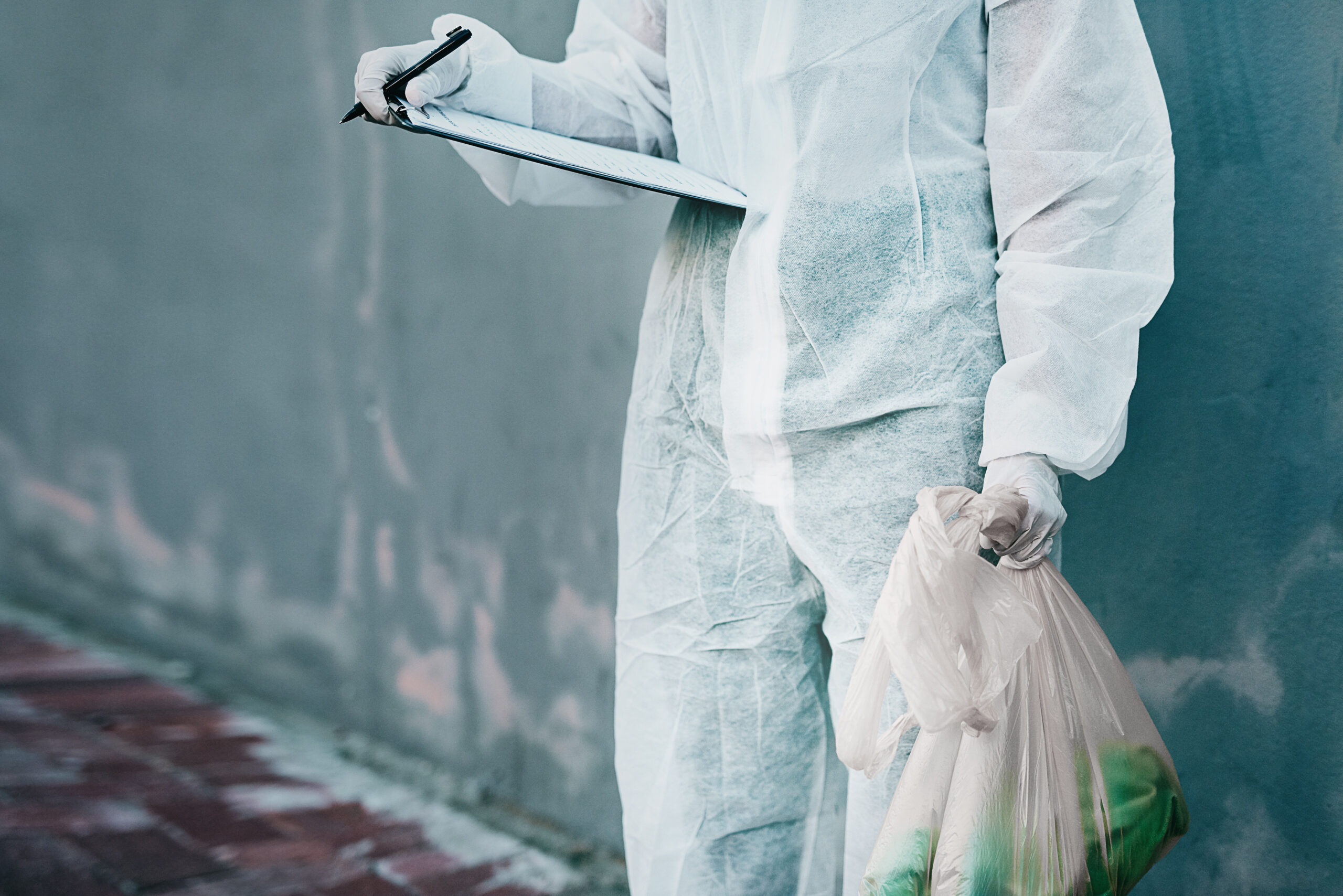 forensic investigator collecting evidence on murder 2190937971