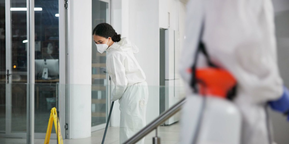 woman, cleaner and mopping for hygiene, fresh and disinfectant for virus protection or housekeeping. people, worker and ppe suit for bacteria, disease and prevention in office as janitor for company